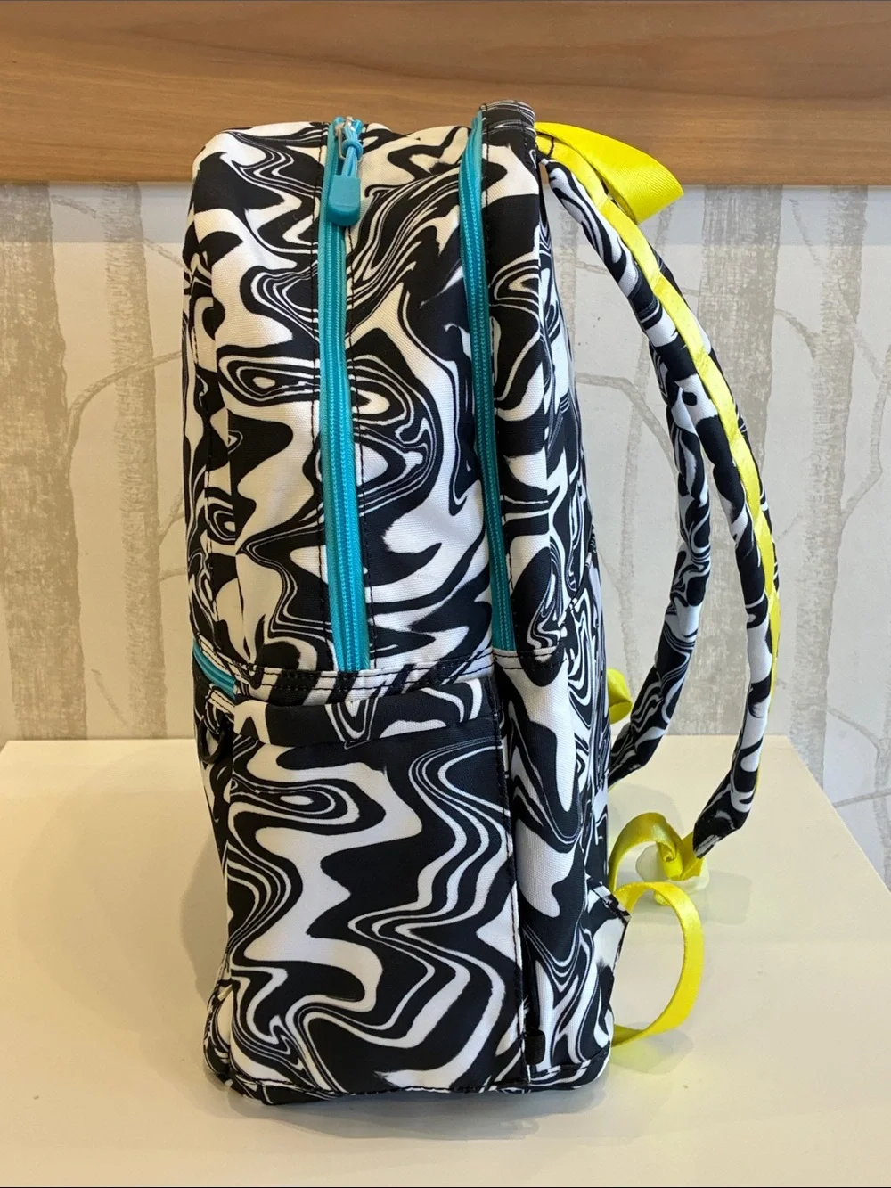 STATE Black & White Swirl Backpack with Pink Logo and Teal Accents
